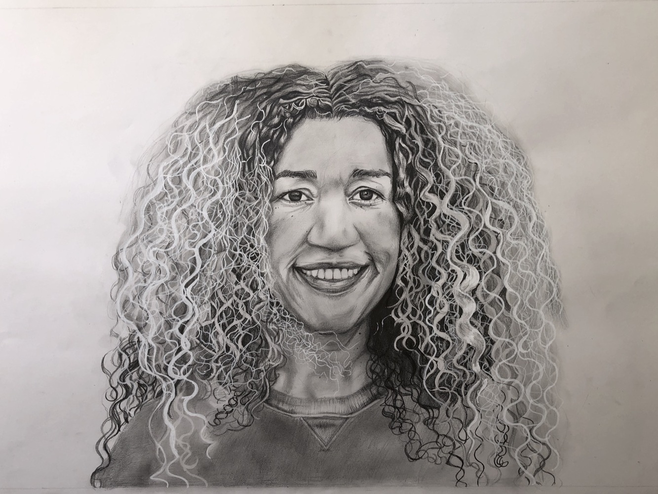 A pencil drawing of a woman.
