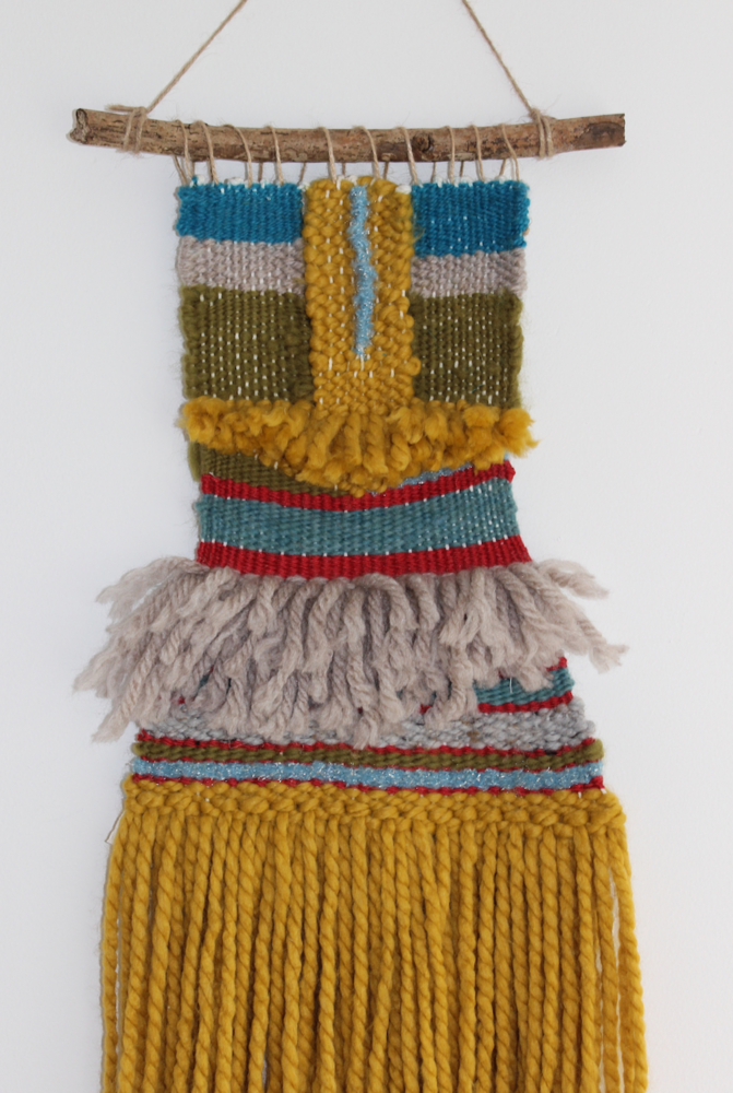 This is woven piece made with bright colours using different types of wool.